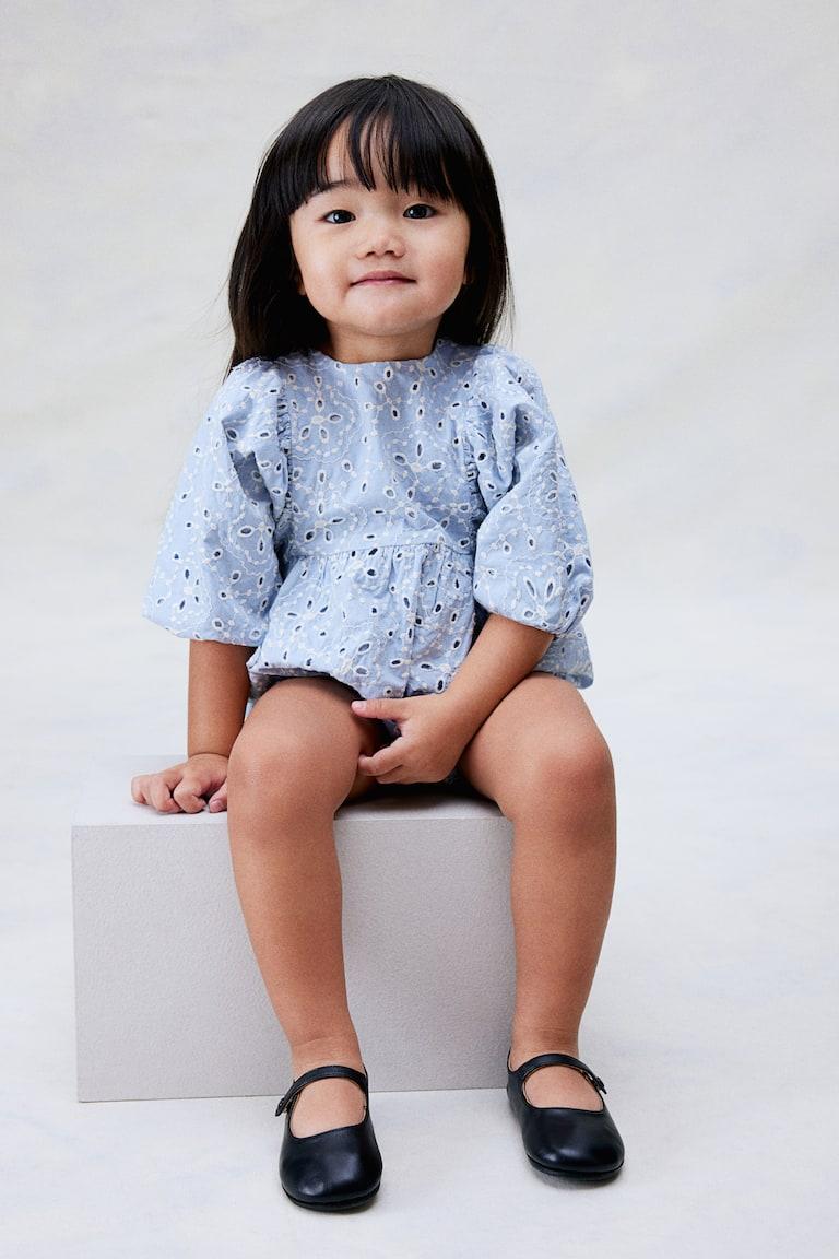 H&M Strampler mit Broderie Anglaise Preisnachlass