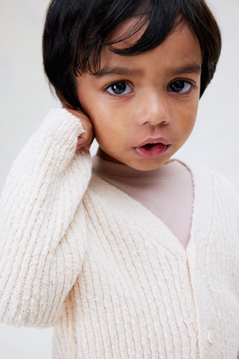 H&M Oversized Cardigan aus Boucléstrick Weihnachtsangebot