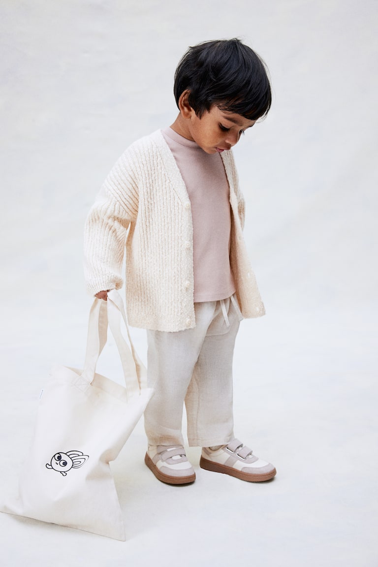 H&M Oversized Cardigan aus Boucléstrick Weihnachtsangebot
