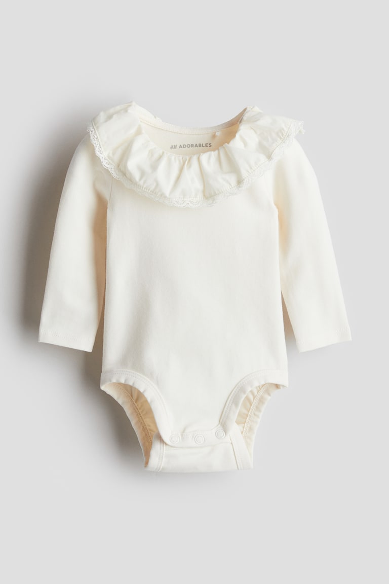 H&M Body mit Volantkragen Saisonale Angebote