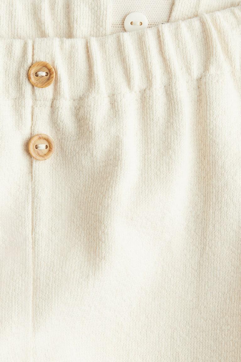 H&M Hose mit Zierknöpfen Tiefpreis