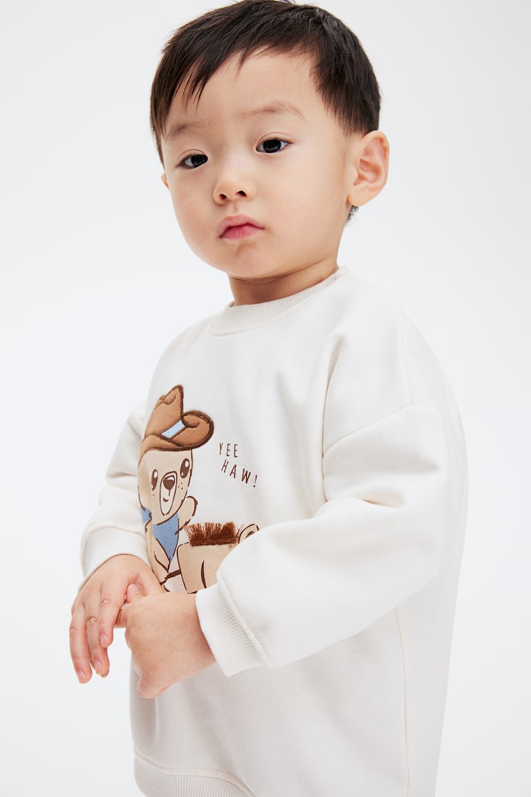 H&M Sweatshirt mit Motiv Clearance-Verkauf