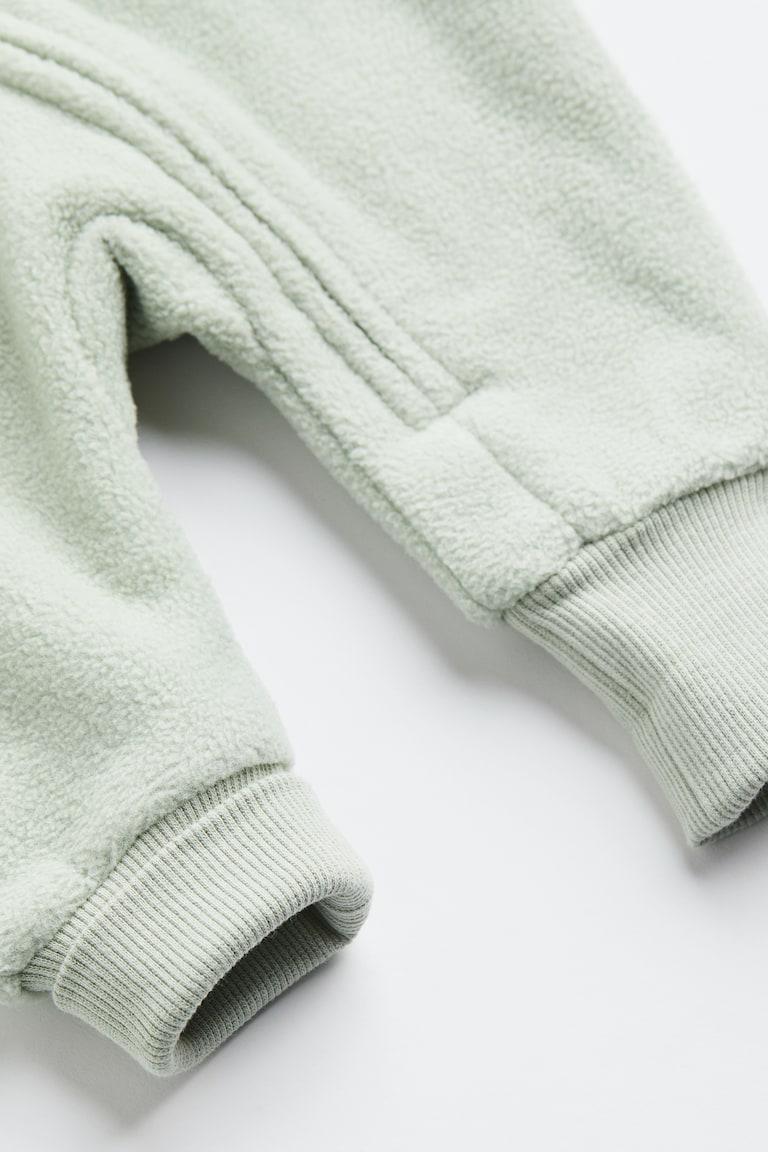 H&M Fleece-Overall mit Kapuze Große Rabatte
