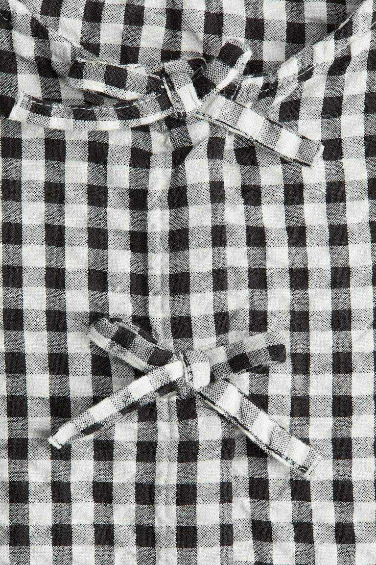 H&M Peplumbluse aus Baumwoll-Seersucker Versandkostenfrei
